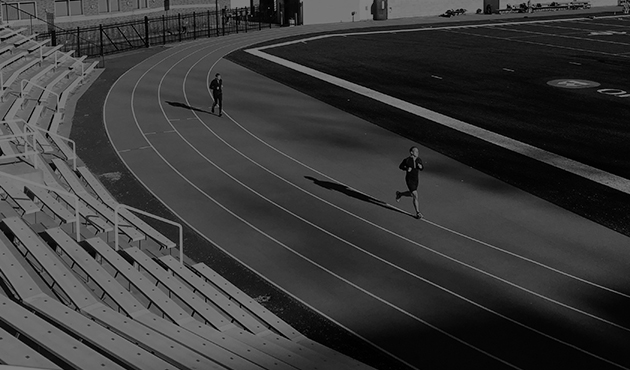 Coach guiding a runner’s stride
