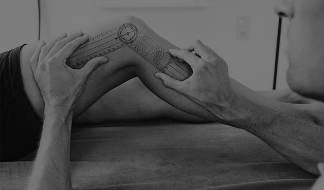 Therapist supporting a client’s lower leg